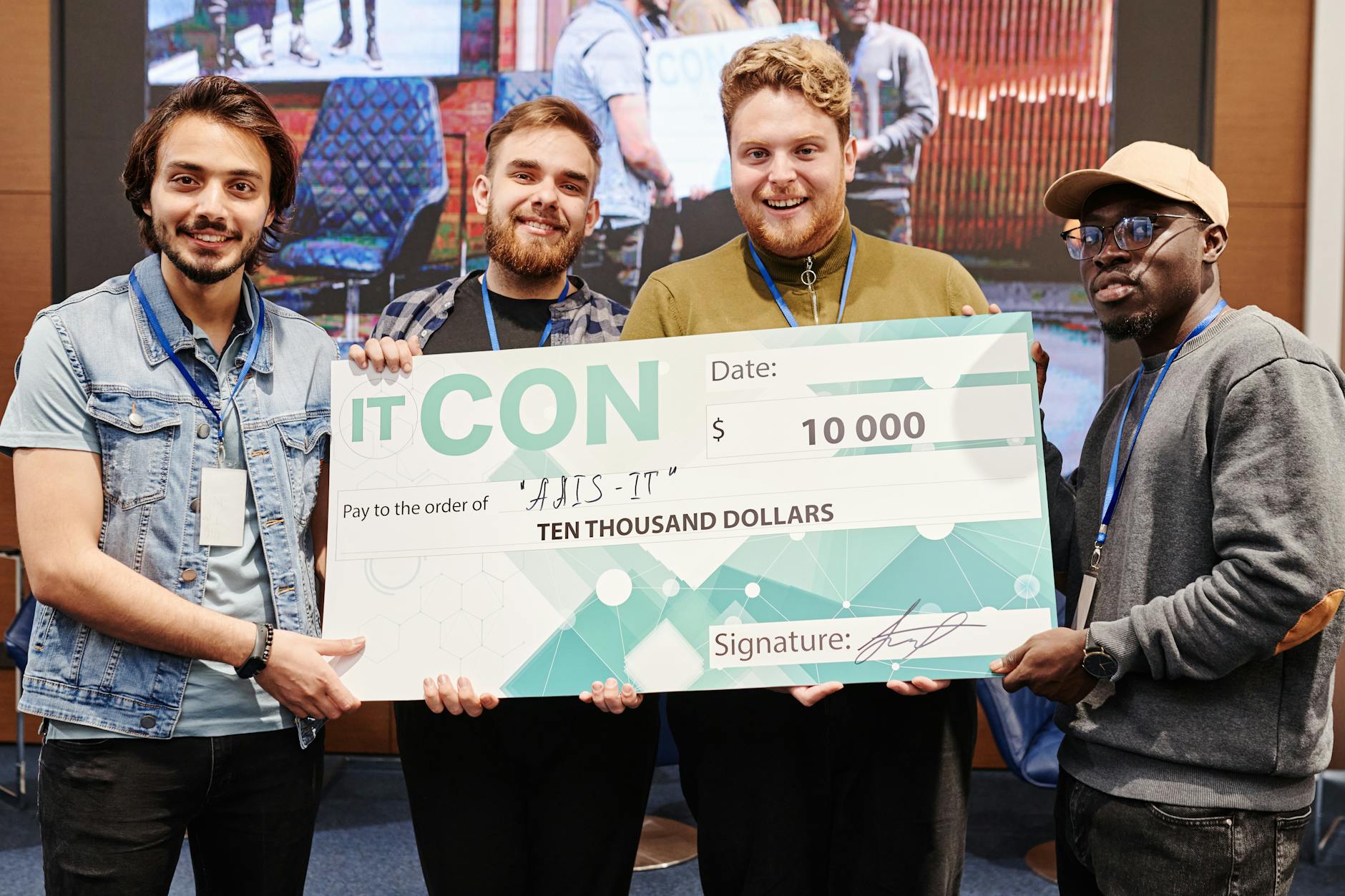 colleagues holding a large cheque
